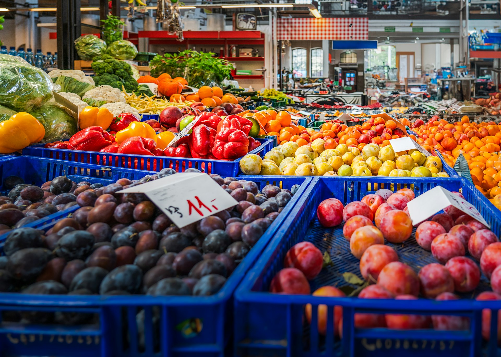 A produce market filled with lots of fresh fruits and vegetables